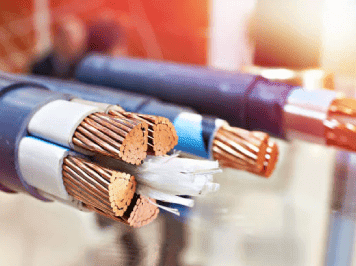 Close-up of multi-core electrical power cables with exposed stranded copper conductors