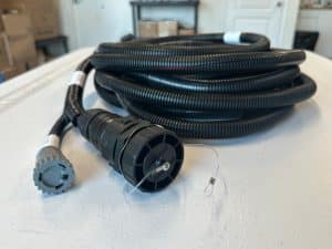 Heavy-duty custom cable assembly with corrugated protective conduit and industrial connectors