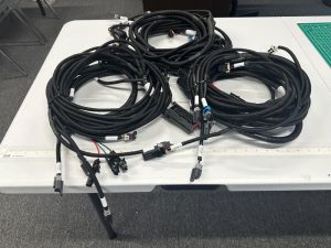 Custom wire harness assembly with multiple connectors and protective corrugated tubing for industrial equipment