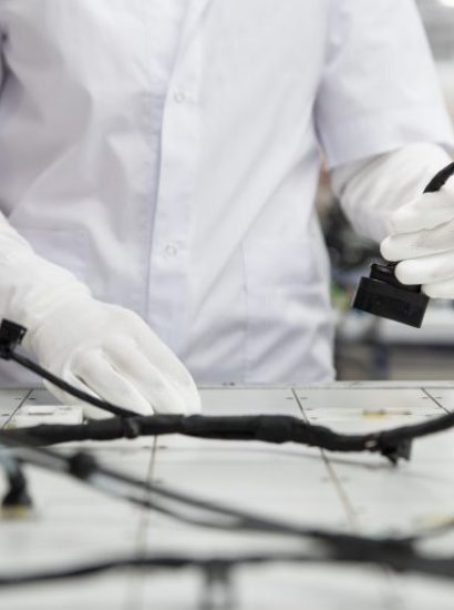 technician assembling electrical wire harness for industrial equipment
